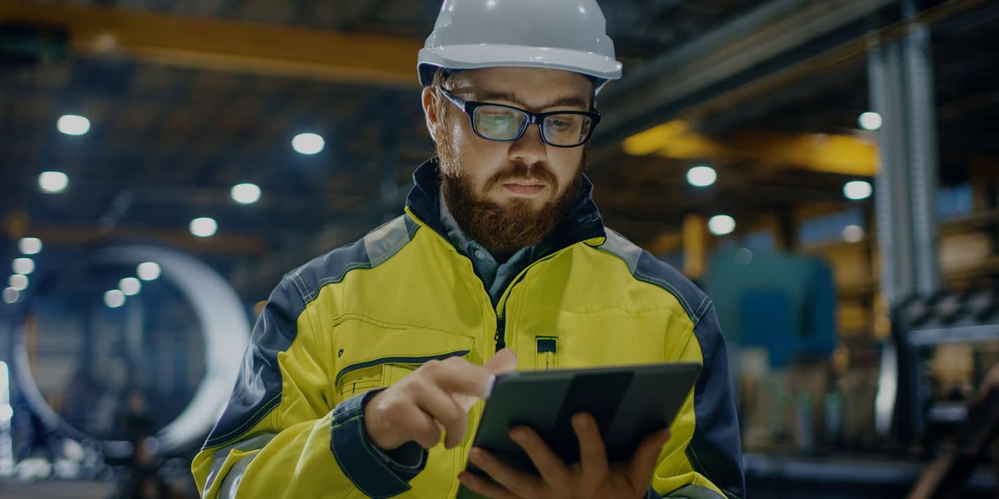 Person using GageList calibration software on Apple iPad